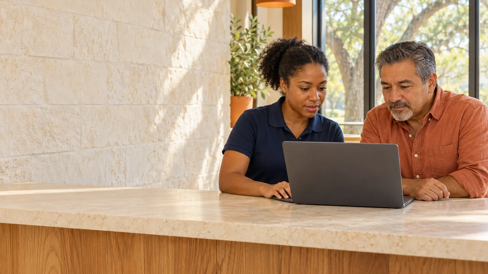 An SEO specialist reviewing search results with a business owner